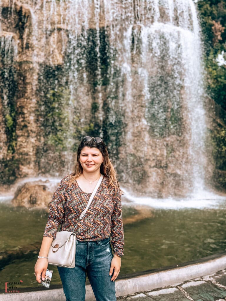 in front of the Waterfall of the Colline du Chateau