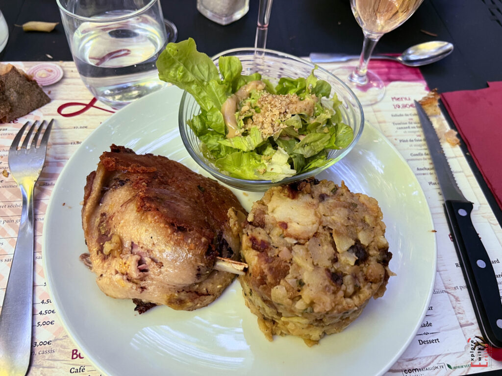 confit de canard served with salad and patatoes