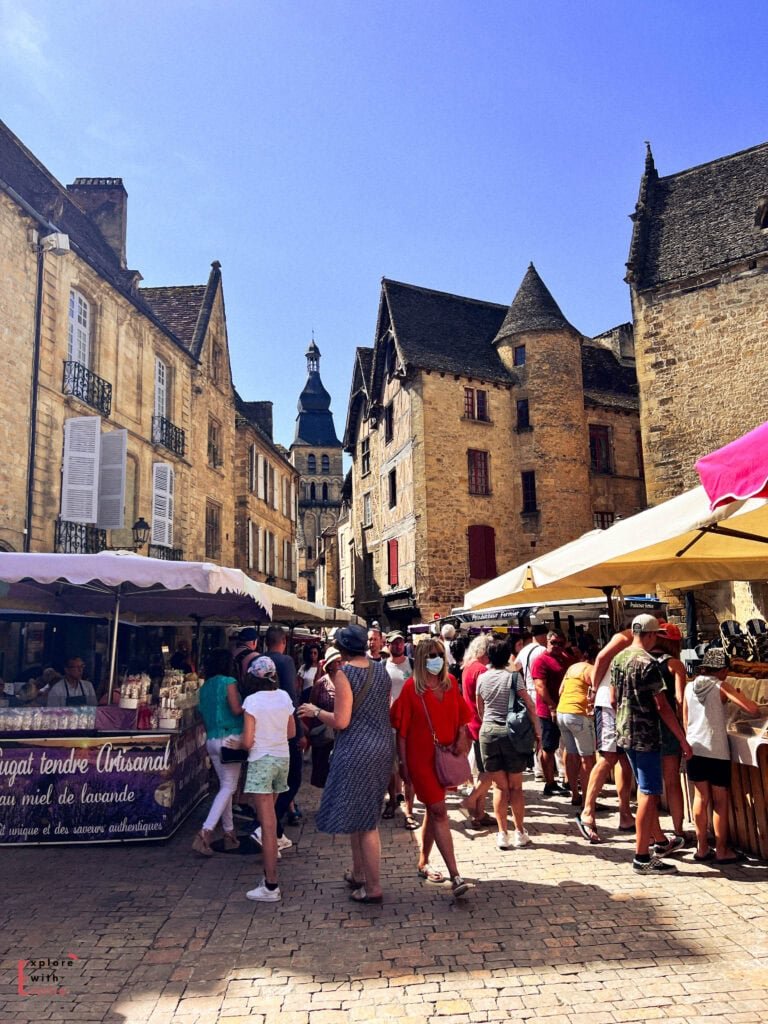 sarlat la caneda market day showing the crowds in the old town